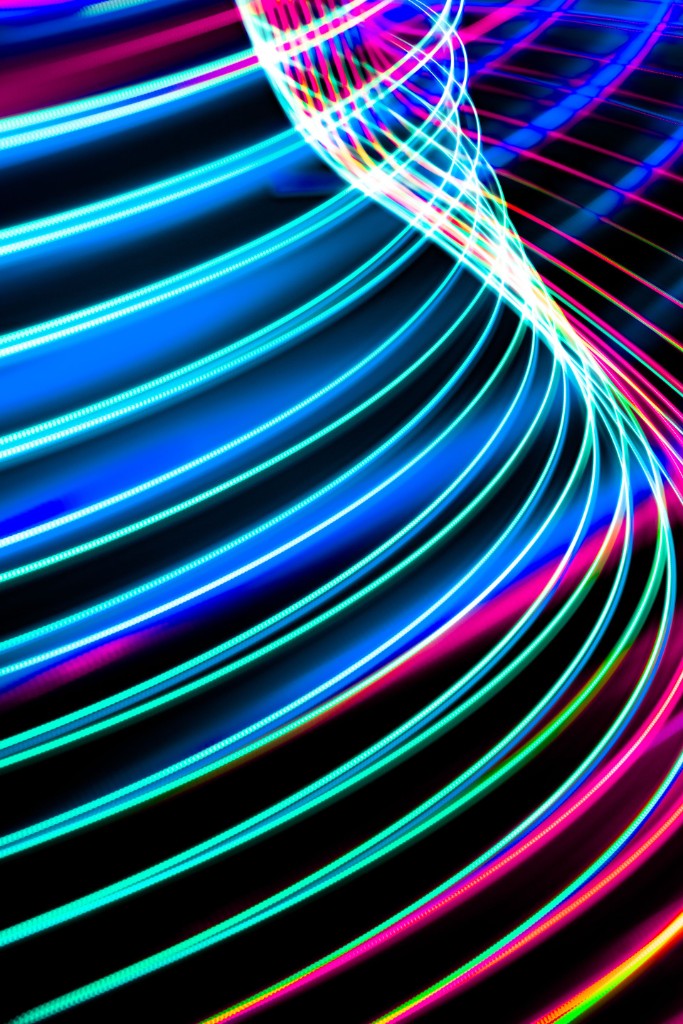 Abstract light trails representing candidates briefed on the real challenge